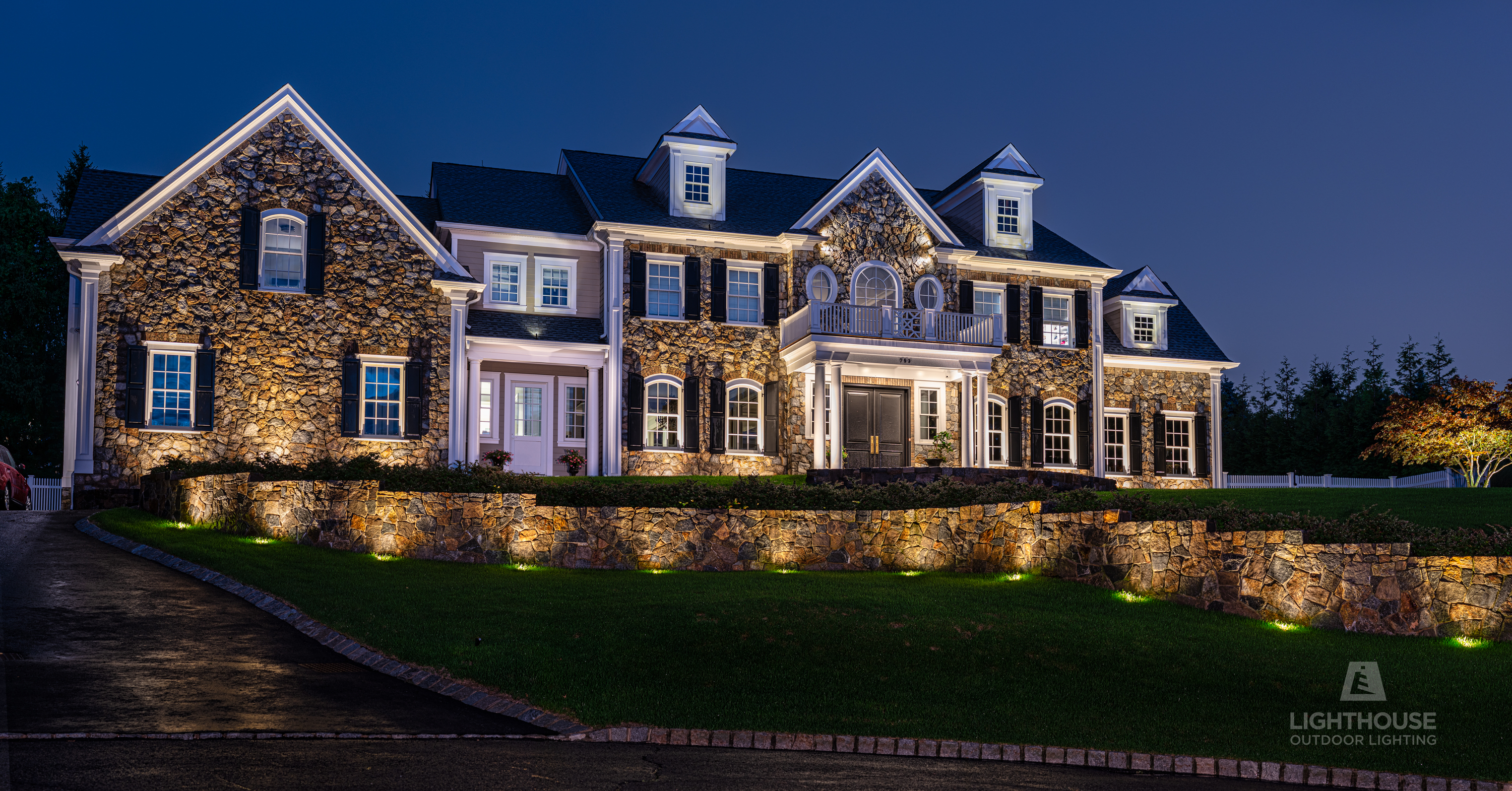 Holiday lighting on luxury home